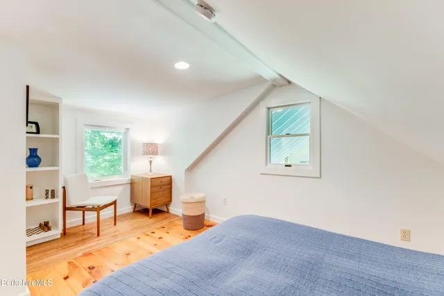 a bedroom with a bed and a table in it