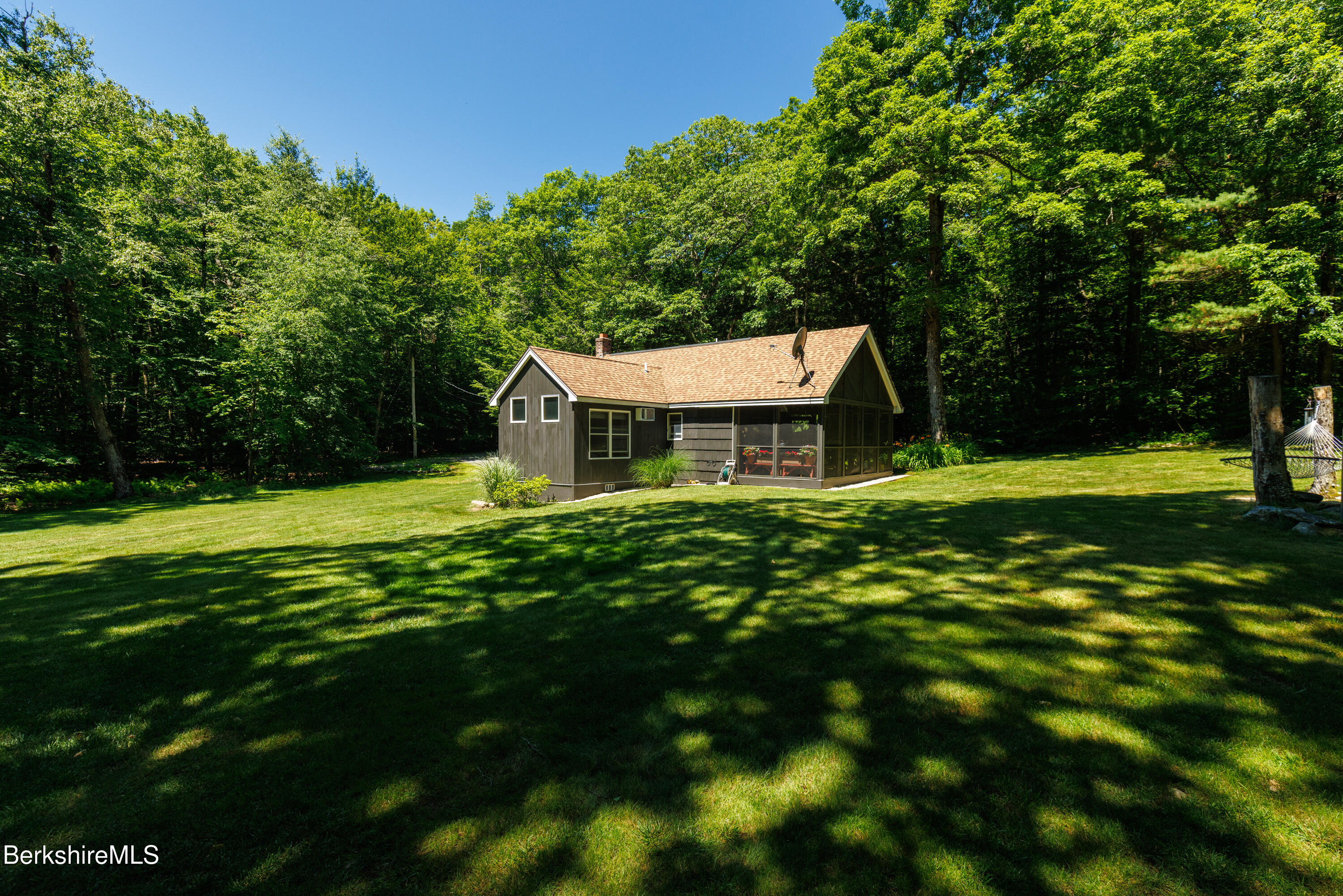 14 Norwalk Acres Road Monterey, MA 01245 - Photo 3 of 56 a front view of house with yard and green space