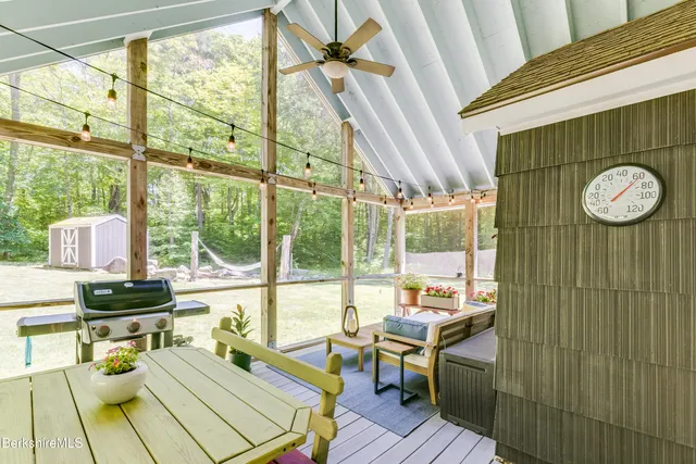 a view of a city from a dining room with a floor to ceiling window