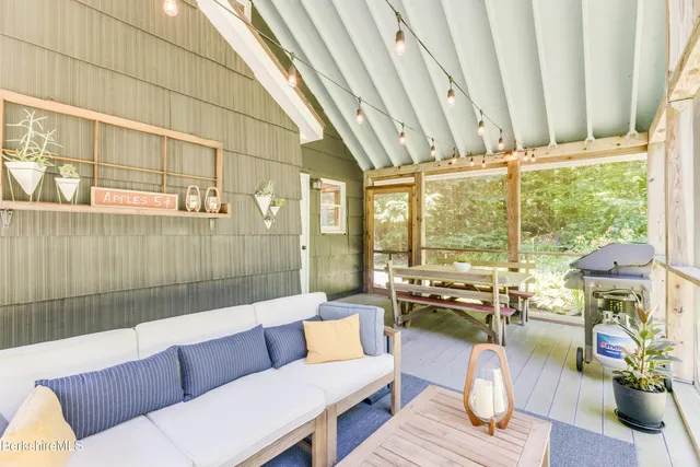 an aerial view of a house with swimming pool and garden