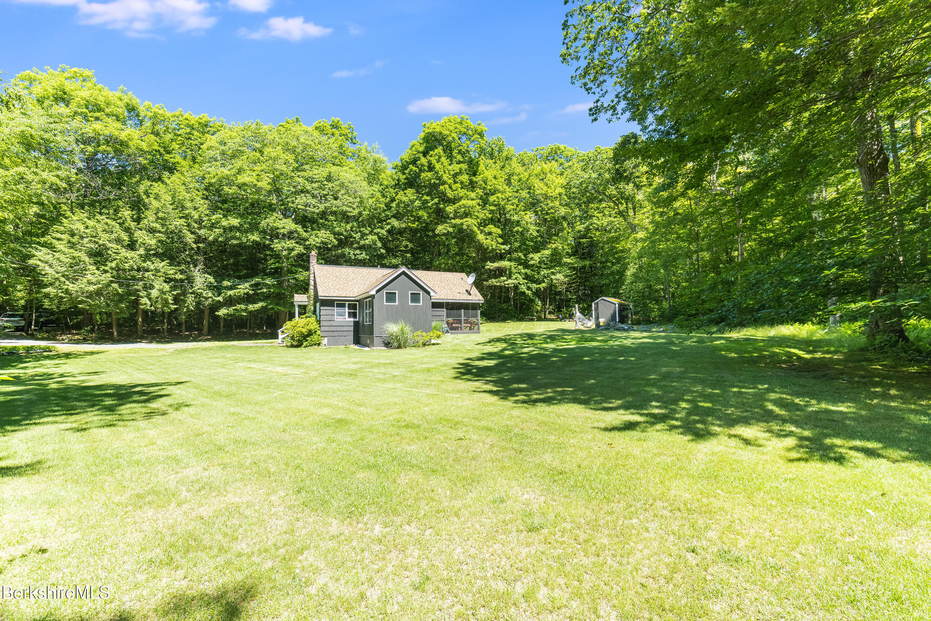 14 Norwalk Acres Road Monterey, MA 01245 - Photo 44 of 56 a view of a house with a yard