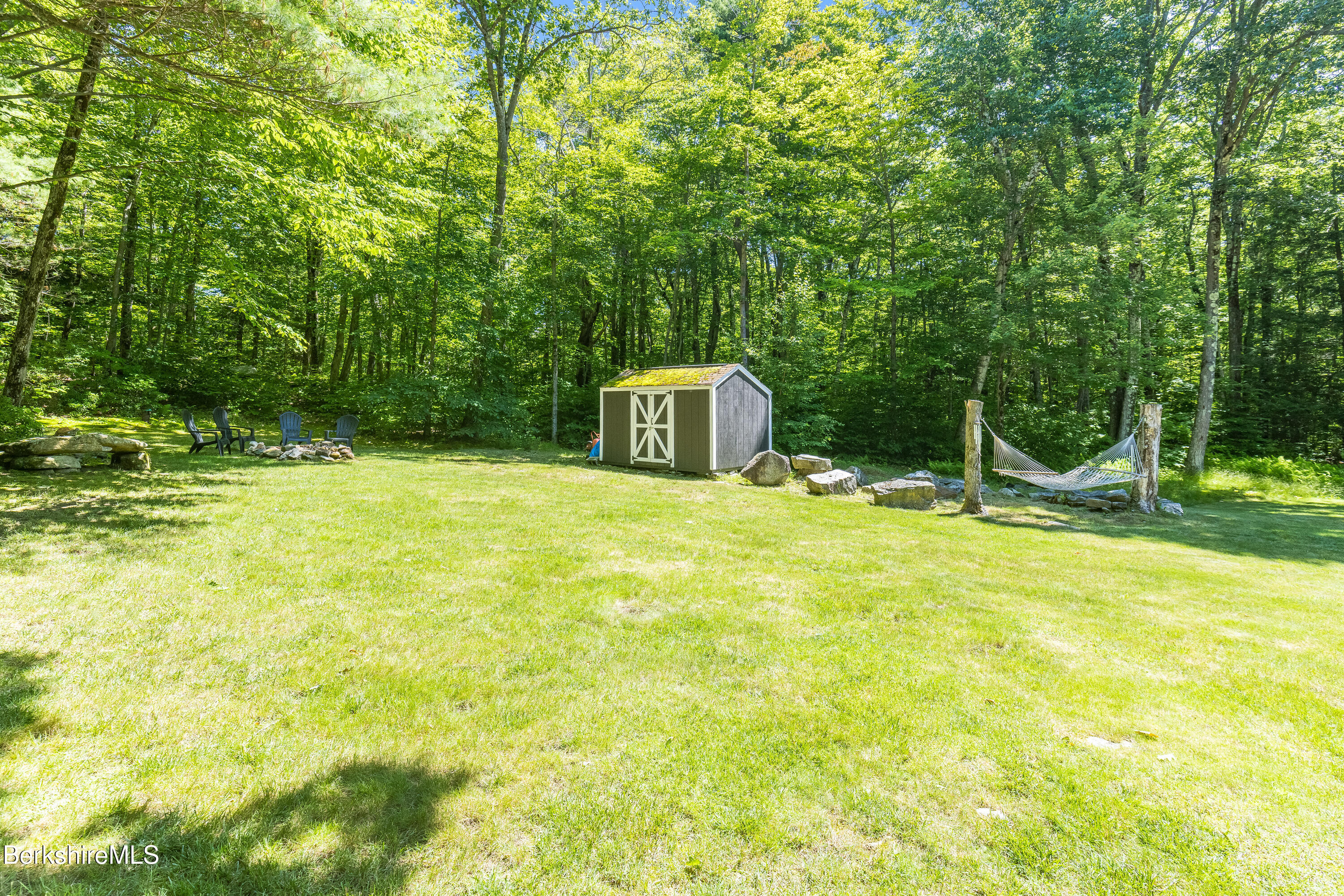 14 Norwalk Acres Road Monterey, MA 01245 - Photo 50 of 56 a view of a swimming pool with a yard and large trees