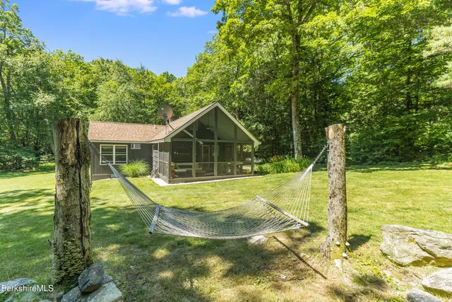 a view of a house with backyard