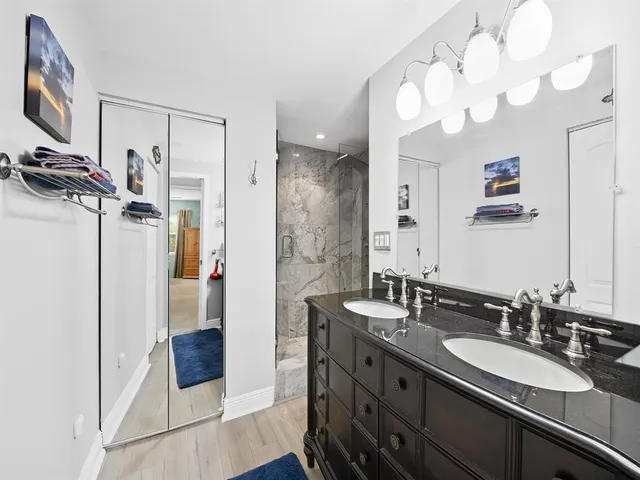 a bathroom with a sink double vanity and a mirror
