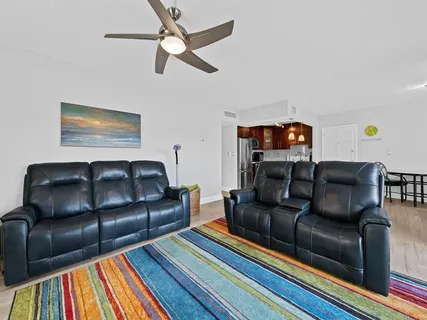 a living room with furniture and a rug