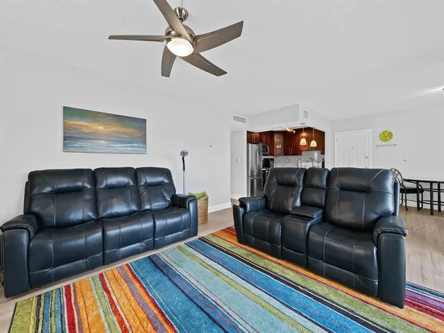 a living room with furniture and a rug
