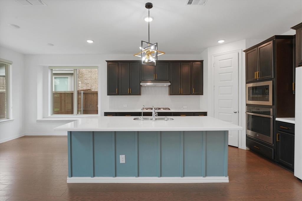 3533 Hyacinth Way Prosper, TX 75078 - Photo 11 of 38 a view of kitchen with granite countertop cabinets and refrigerator