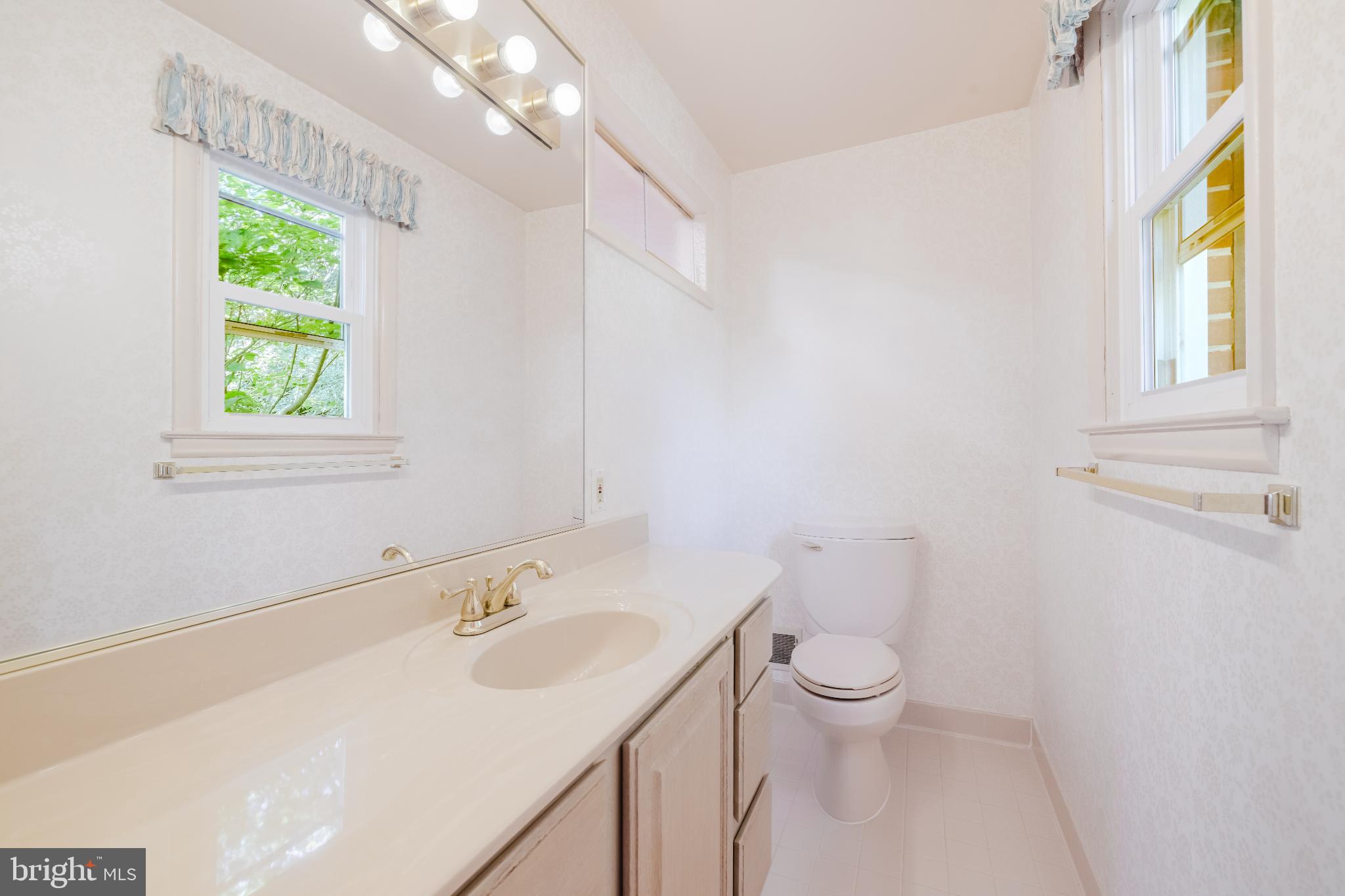 814 West Padonia Road Cockeysville, MD 21030 - Photo 13 of 28 a bathroom with a sink a toilet and a window