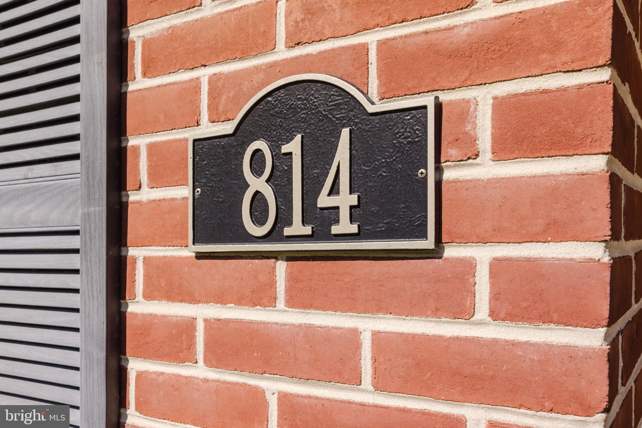 814 West Padonia Road Cockeysville, MD 21030 - Photo 2 of 28 a street sign sitting on a wall next to a building