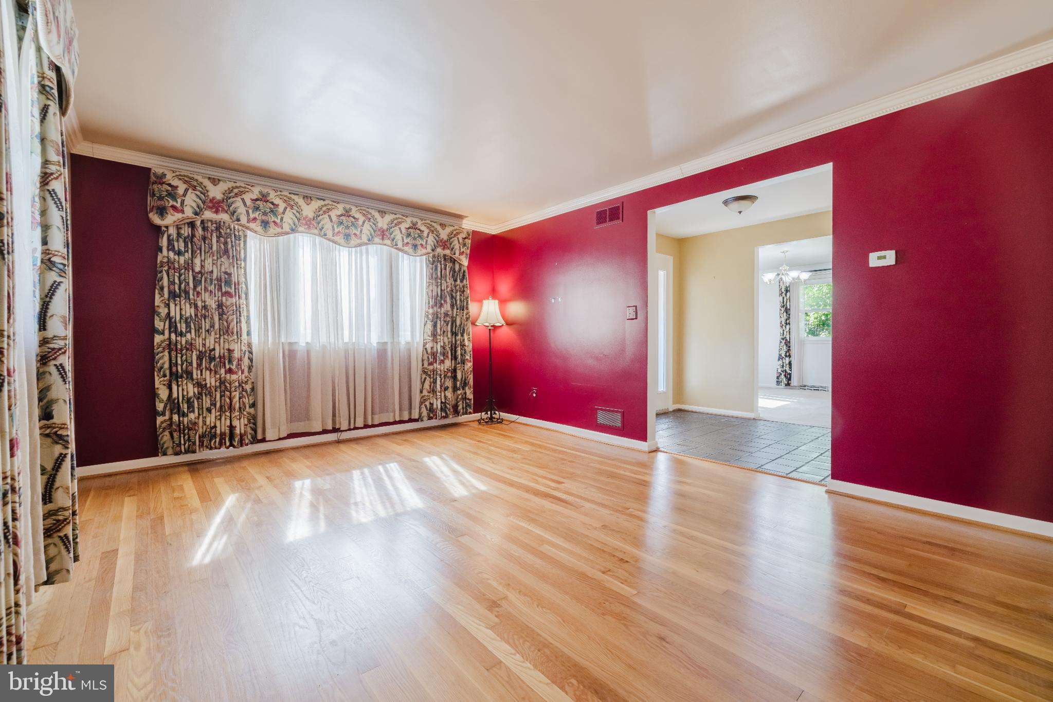 814 West Padonia Road Cockeysville, MD 21030 - Photo 5 of 28 a view of an empty room with wooden floor and a window