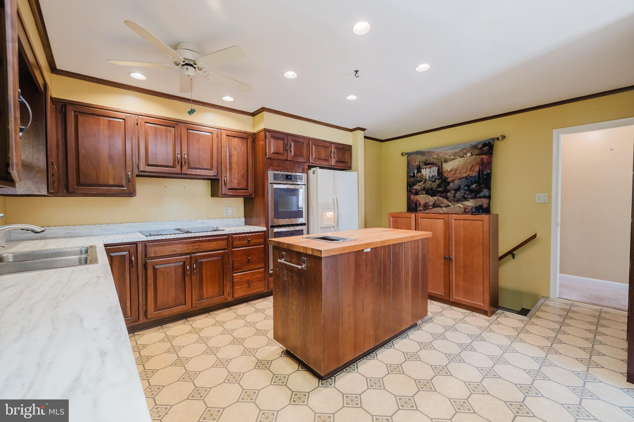 814 West Padonia Road Cockeysville, MD 21030 - Photo 9 of 28 a kitchen with stainless steel appliances granite countertop a stove a sink a refrigerator and a cabinets