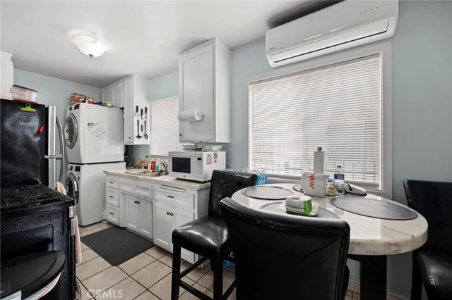 a room with a bed and a flat screen tv