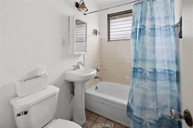 a bedroom with a bed and flat screen tv