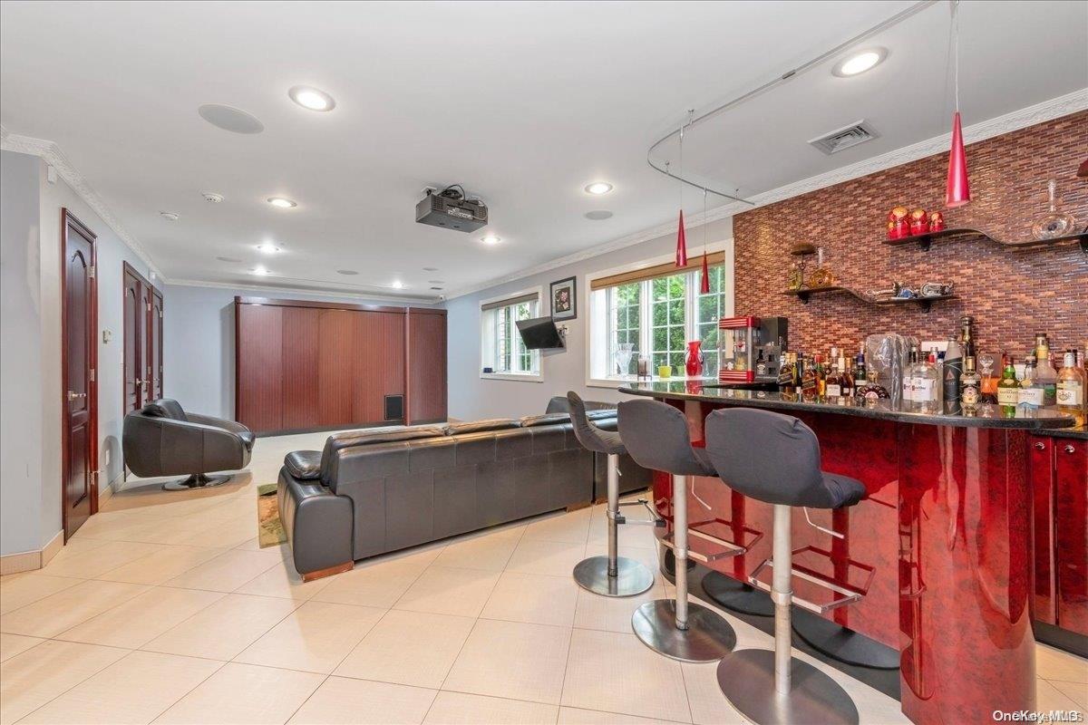 153-02 77th Avenue Queens, NY 11367 - Photo 14 of 23 a kitchen with stainless steel appliances granite countertop a sink and cabinets