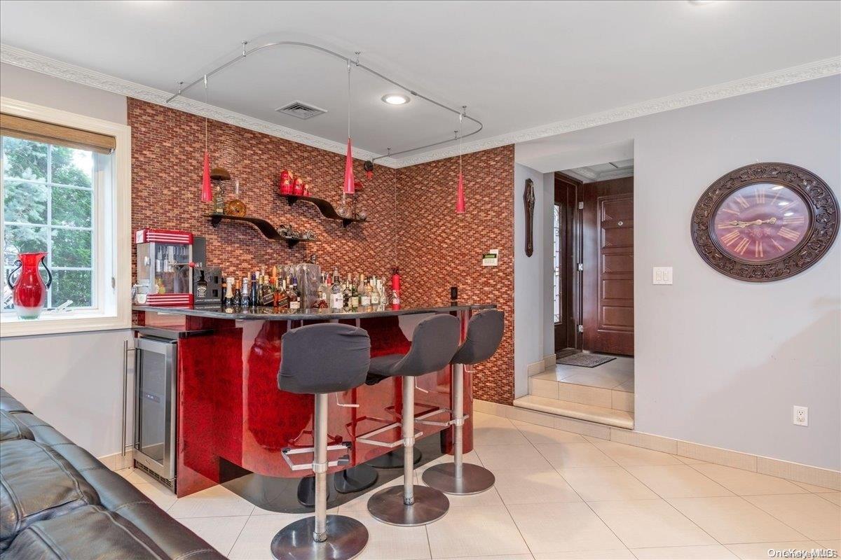 153-02 77th Avenue Queens, NY 11367 - Photo 15 of 23 a dining room with furniture and window