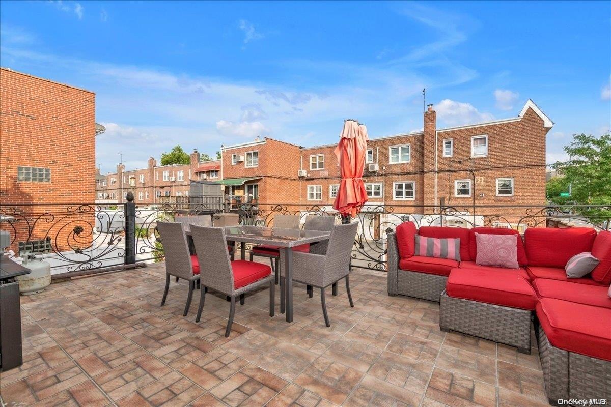 153-02 77th Avenue Queens, NY 11367 - Photo 16 of 23 a view of a chairs and table in patio