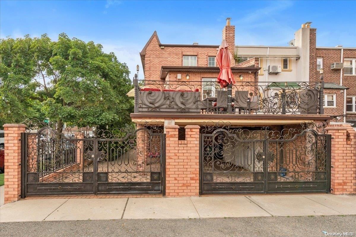 153-02 77th Avenue Queens, NY 11367 - Photo 19 of 23 a front view of a building with glass windows