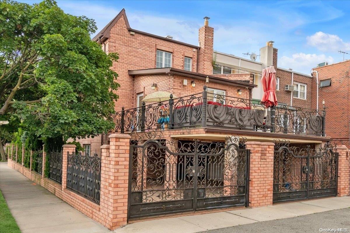 153-02 77th Avenue Queens, NY 11367 - Photo 20 of 23 a front view of a building with glass windows and door
