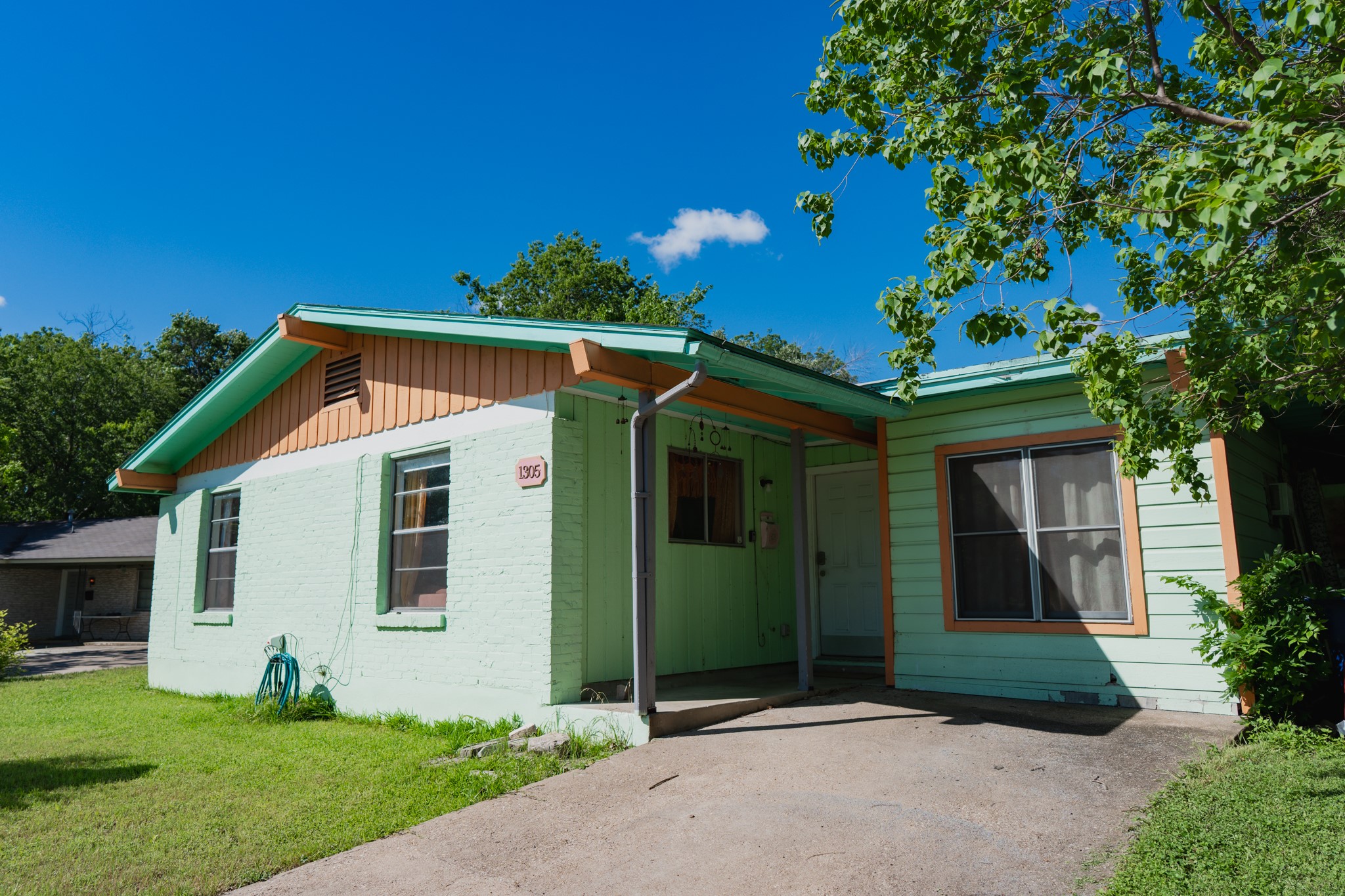 1305 Larkspur Road Austin, TX 78758 - Photo 1 of 1 View of front facade with a front lawn