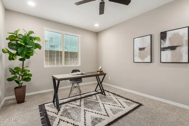 a view of a workspace with furniture
