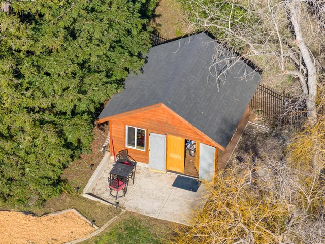 a backyard of a house with seating space