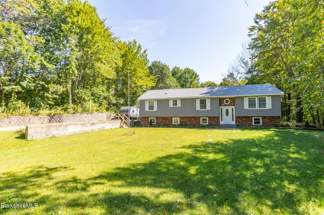 a front view of a house with swimming pool
