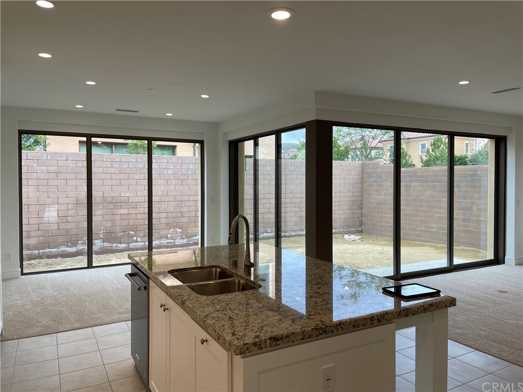 191 Oceano Irvine, CA 92602 - Photo 3 of 11 a kitchen with a counter top a sink and cabinets