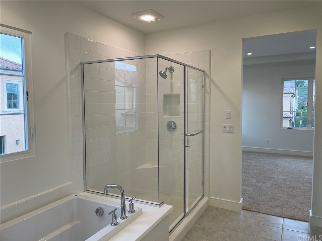 191 Oceano Irvine, CA 92602 - Photo 7 of 11 a bathroom with a shower and a tub
