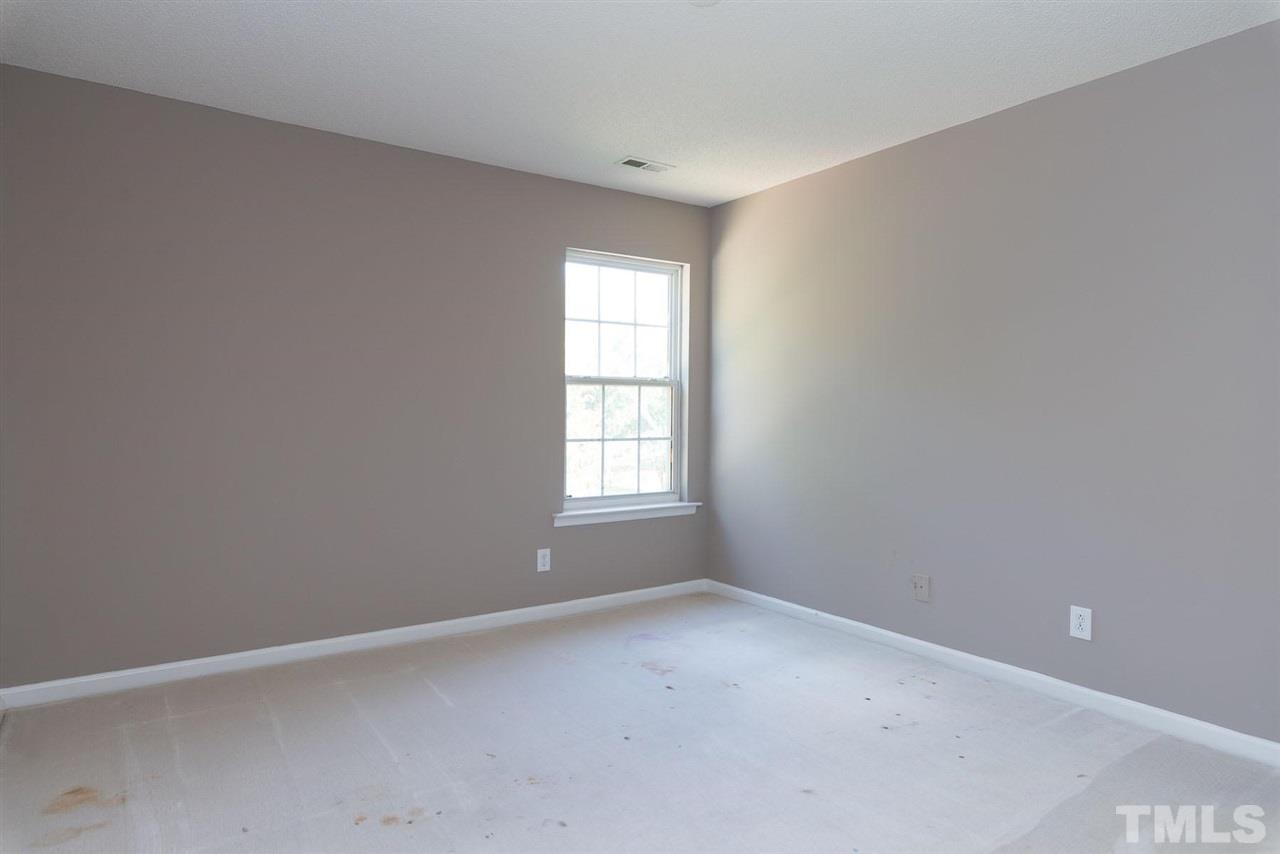 8120 Tara Ridge Road Raleigh, NC 27616 - Photo 12 of 22 an empty room with a window