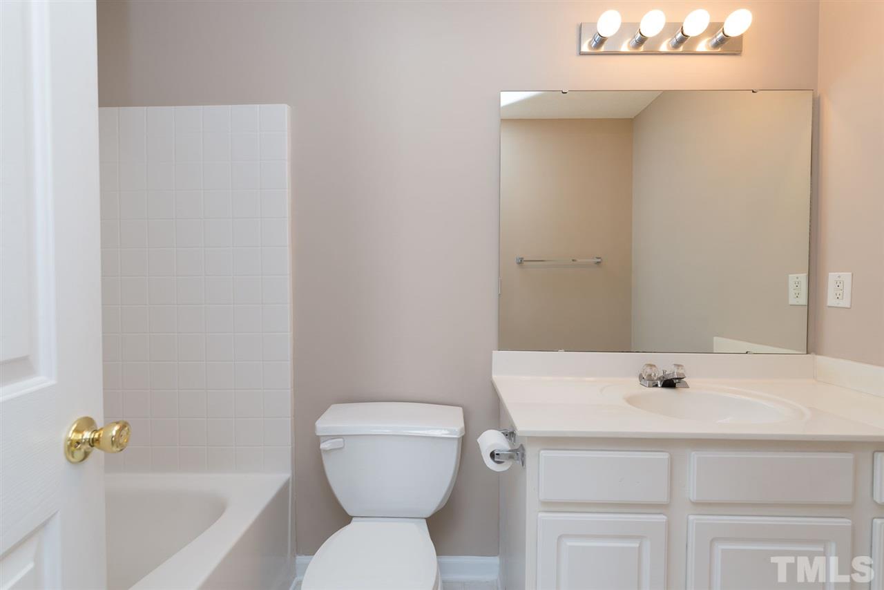 8120 Tara Ridge Road Raleigh, NC 27616 - Photo 18 of 22 a bathroom with a sink a toilet and shower