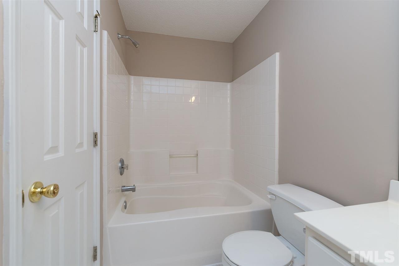8120 Tara Ridge Road Raleigh, NC 27616 - Photo 19 of 22 a bathroom with a toilet and a bathtub