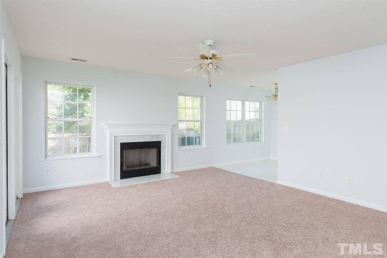 8120 Tara Ridge Road Raleigh, NC 27616 - Photo 3 of 22 a view of an empty room with a window