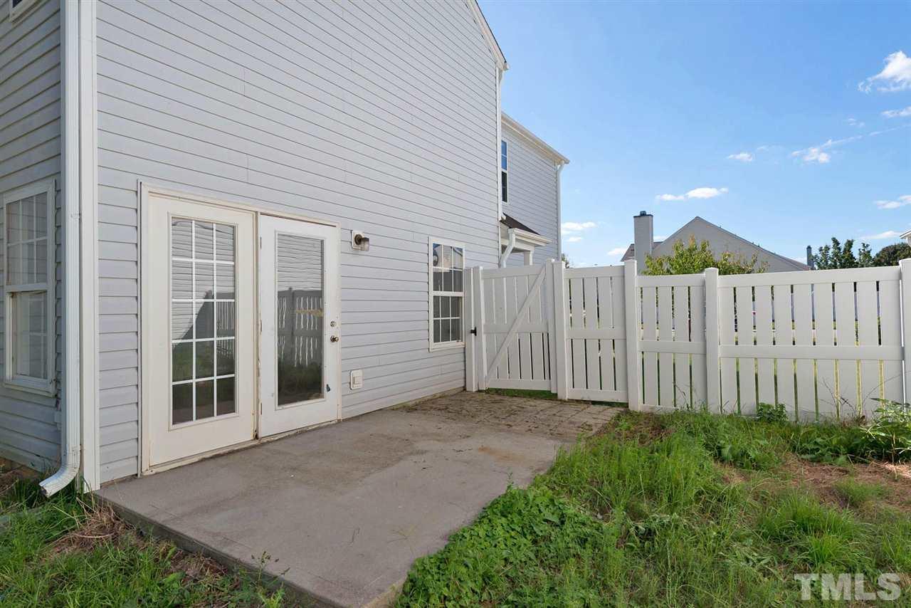 8120 Tara Ridge Road Raleigh, NC 27616 - Photo 21 of 22 a view of a house with backyard and garden
