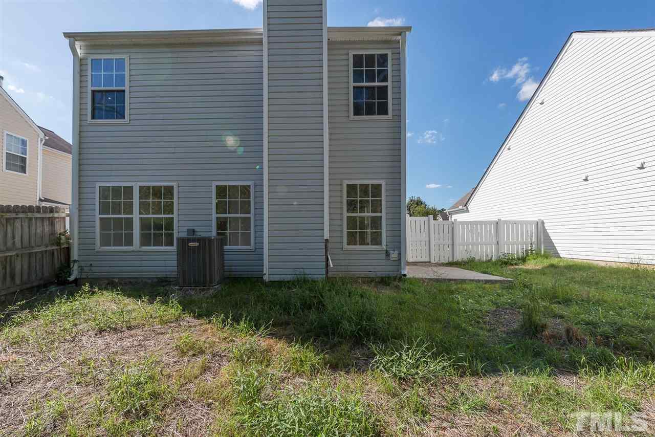 8120 Tara Ridge Road Raleigh, NC 27616 - Photo 22 of 22 a view of a house with a yard