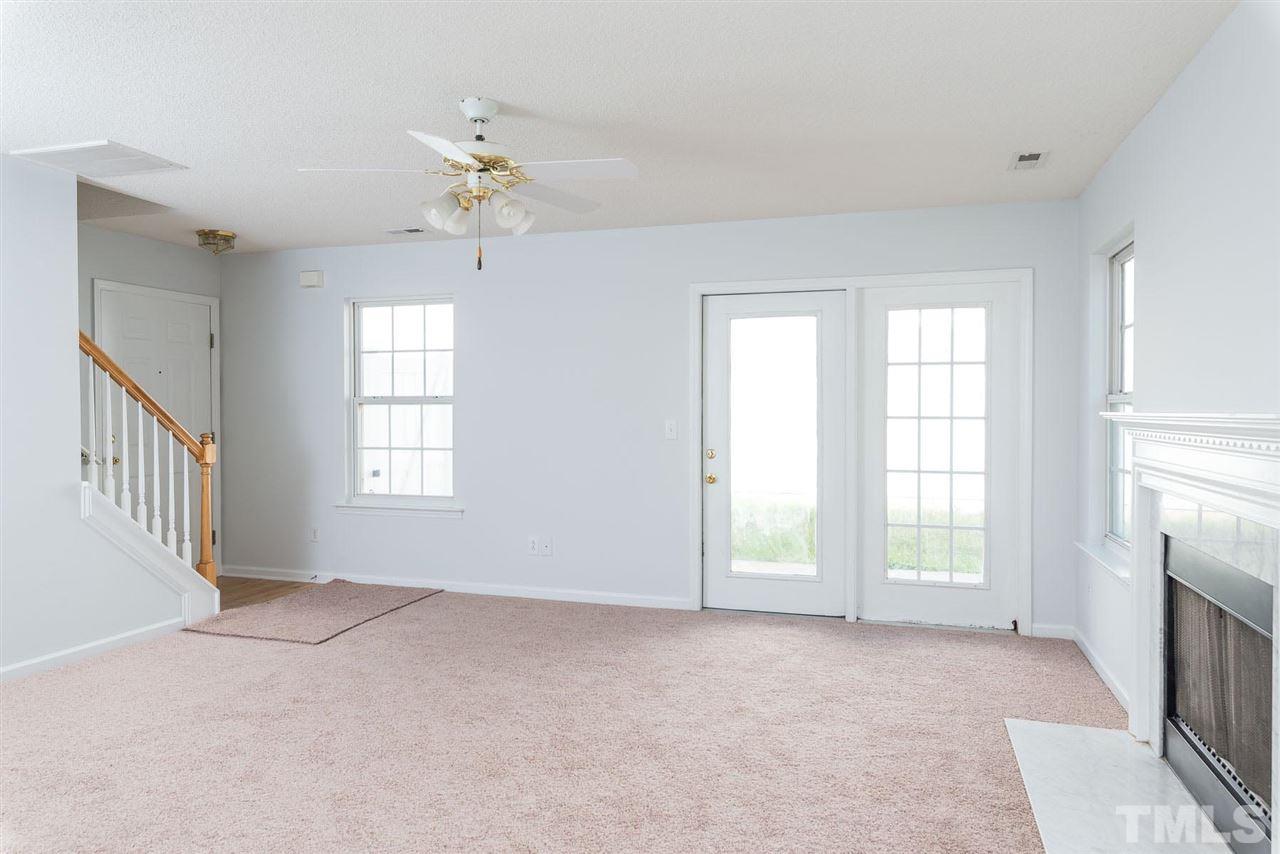 8120 Tara Ridge Road Raleigh, NC 27616 - Photo 5 of 22 a view of an empty room with a window