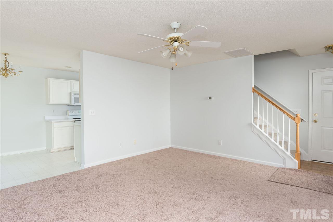 8120 Tara Ridge Road Raleigh, NC 27616 - Photo 6 of 22 a view of an empty room with chandelier fan