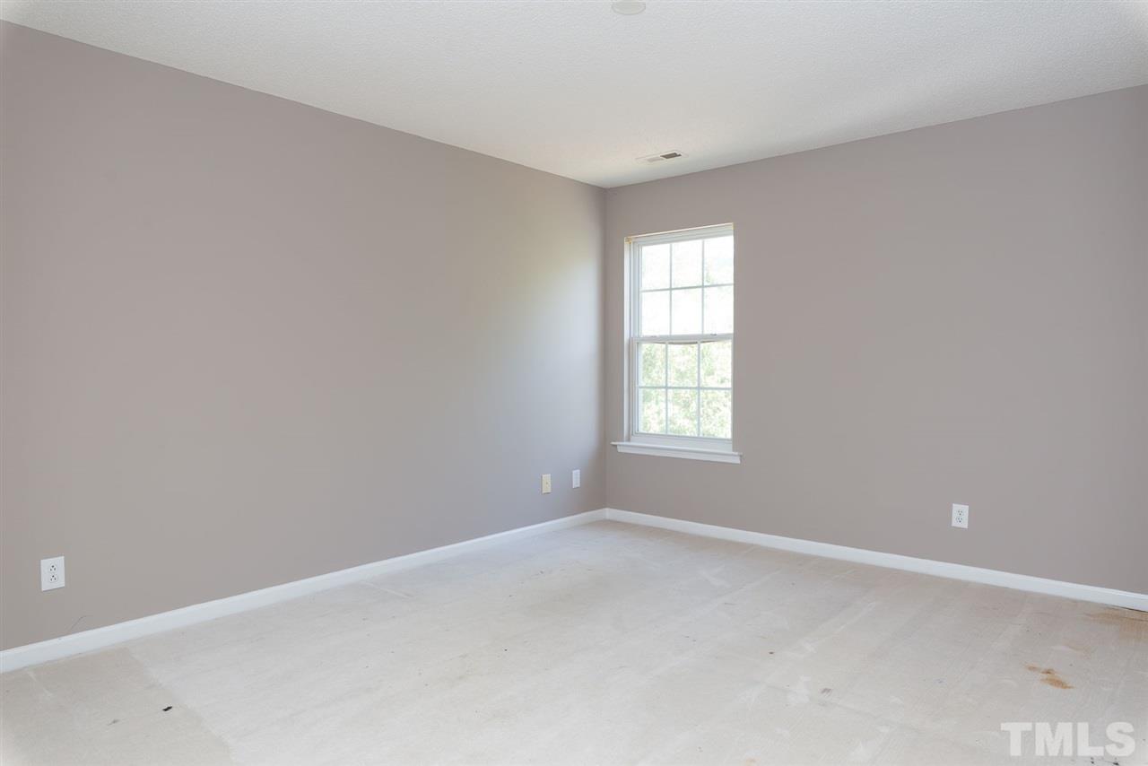 8120 Tara Ridge Road Raleigh, NC 27616 - Photo 10 of 22 an empty room with a window