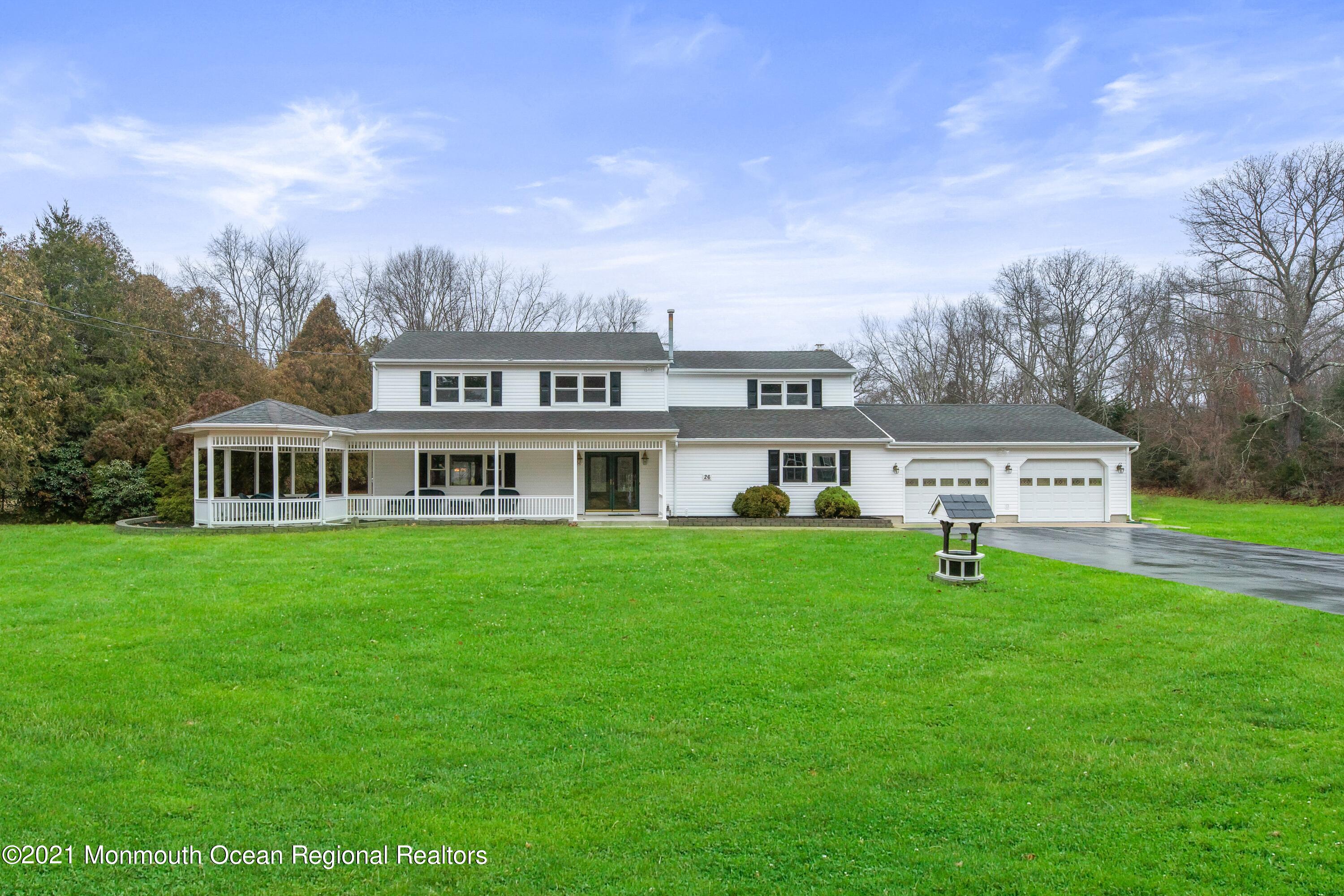 26 Squan Road Millstone Township, NJ 08510 - Photo 1 of 24 a front view of a house with a garden