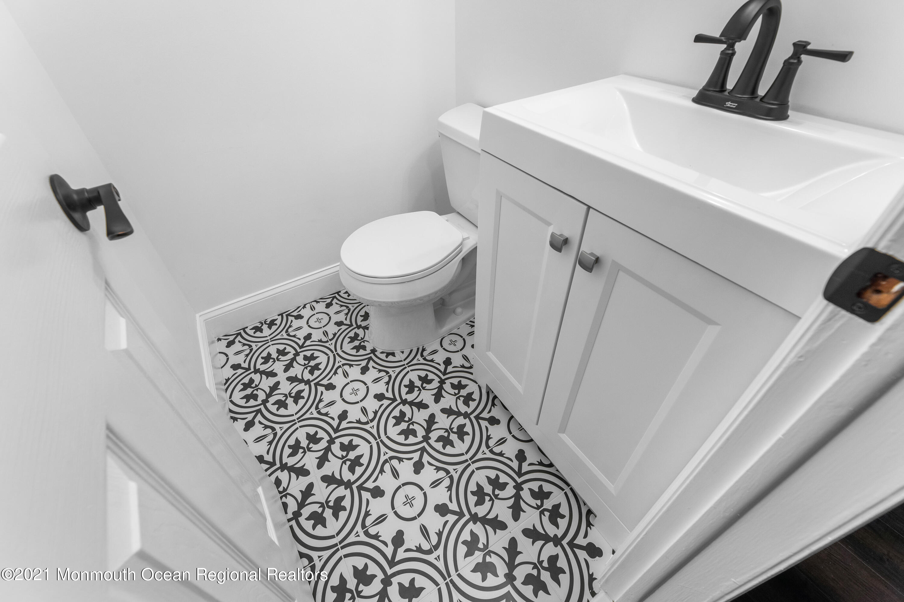 26 Squan Road Millstone Township, NJ 08510 - Photo 12 of 24 a bathroom with a toilet and a sink