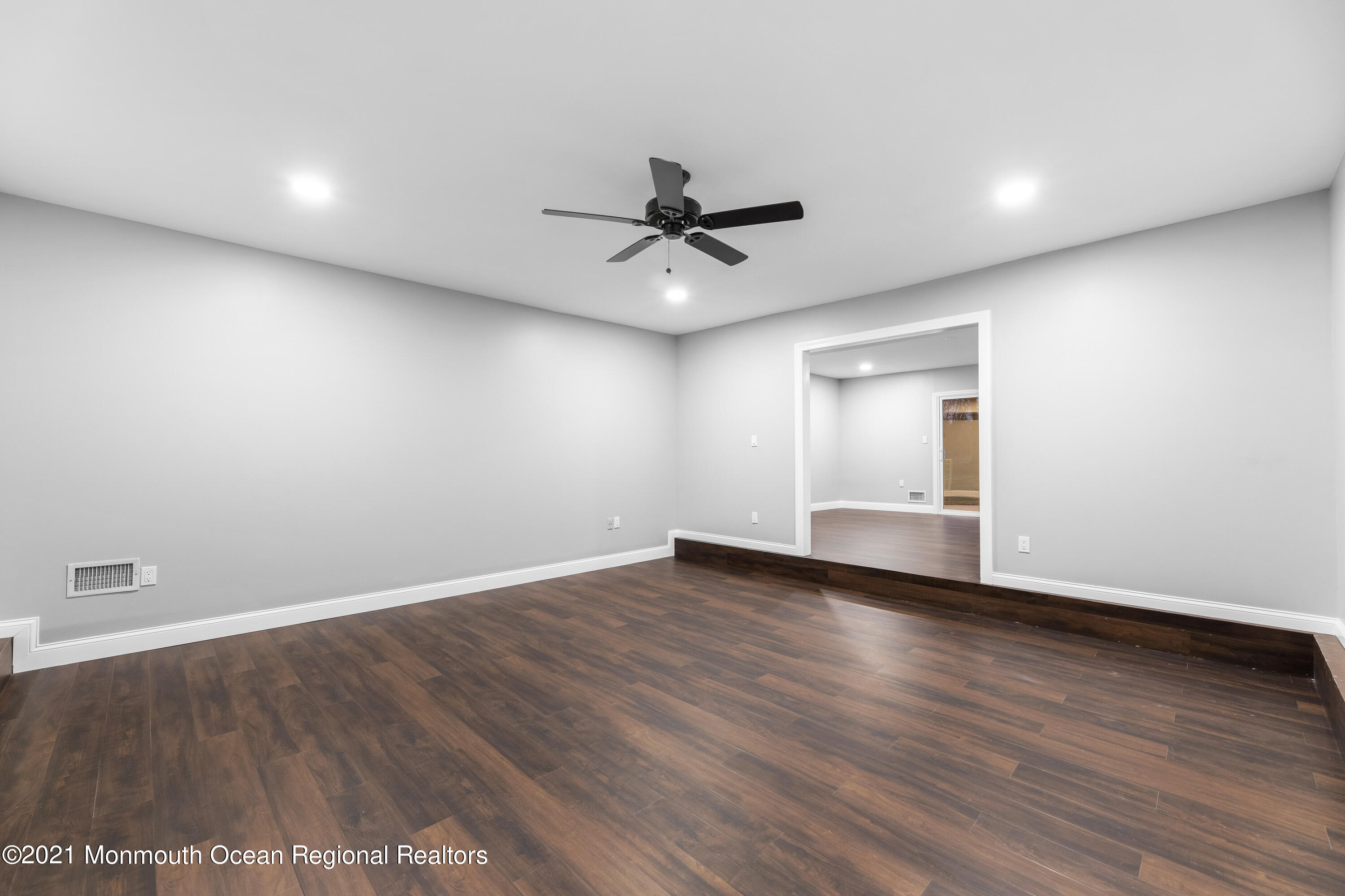 26 Squan Road Millstone Township, NJ 08510 - Photo 14 of 24 wooden floor in an empty room with a window