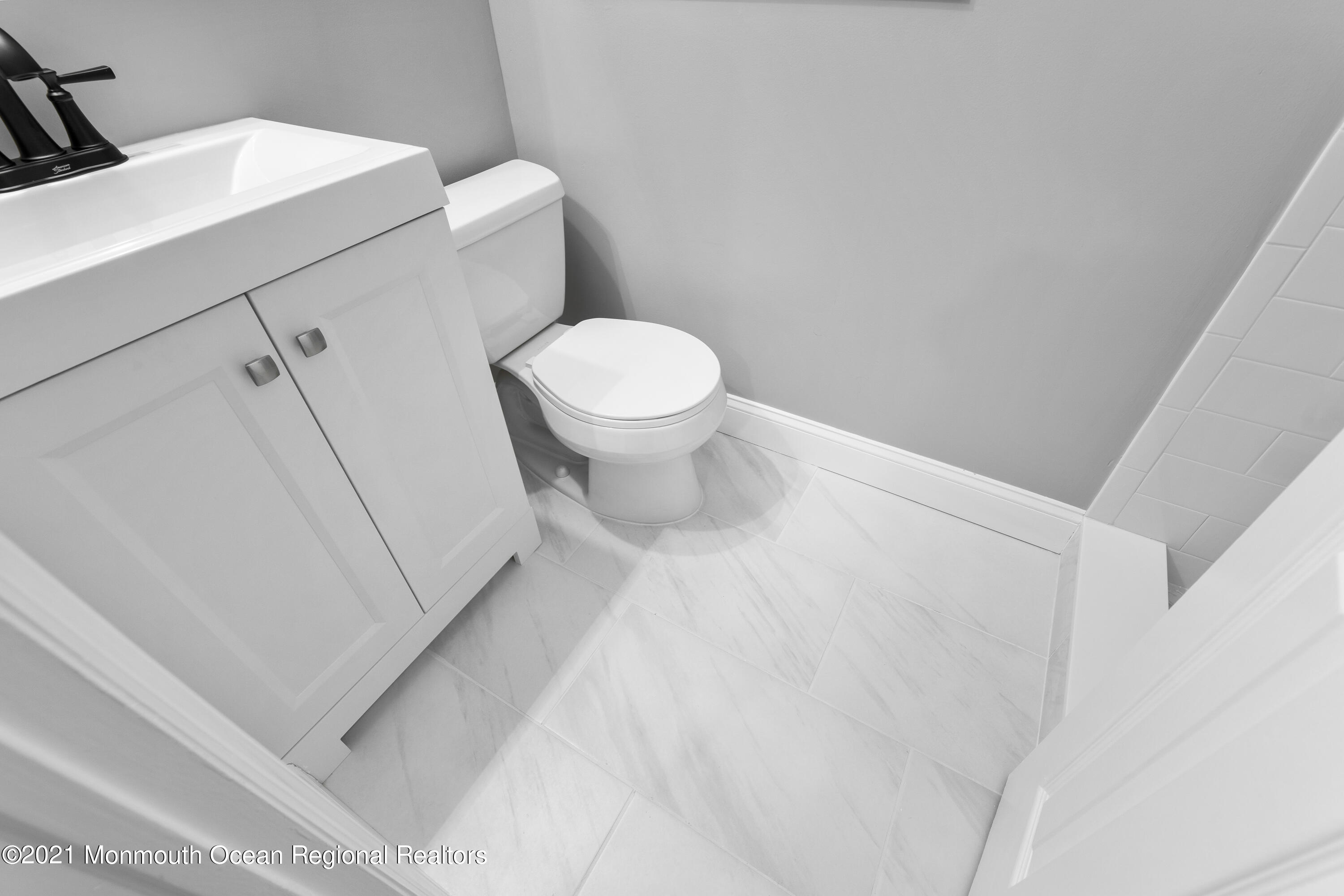 26 Squan Road Millstone Township, NJ 08510 - Photo 19 of 24 a white toilet sitting next to a white sink