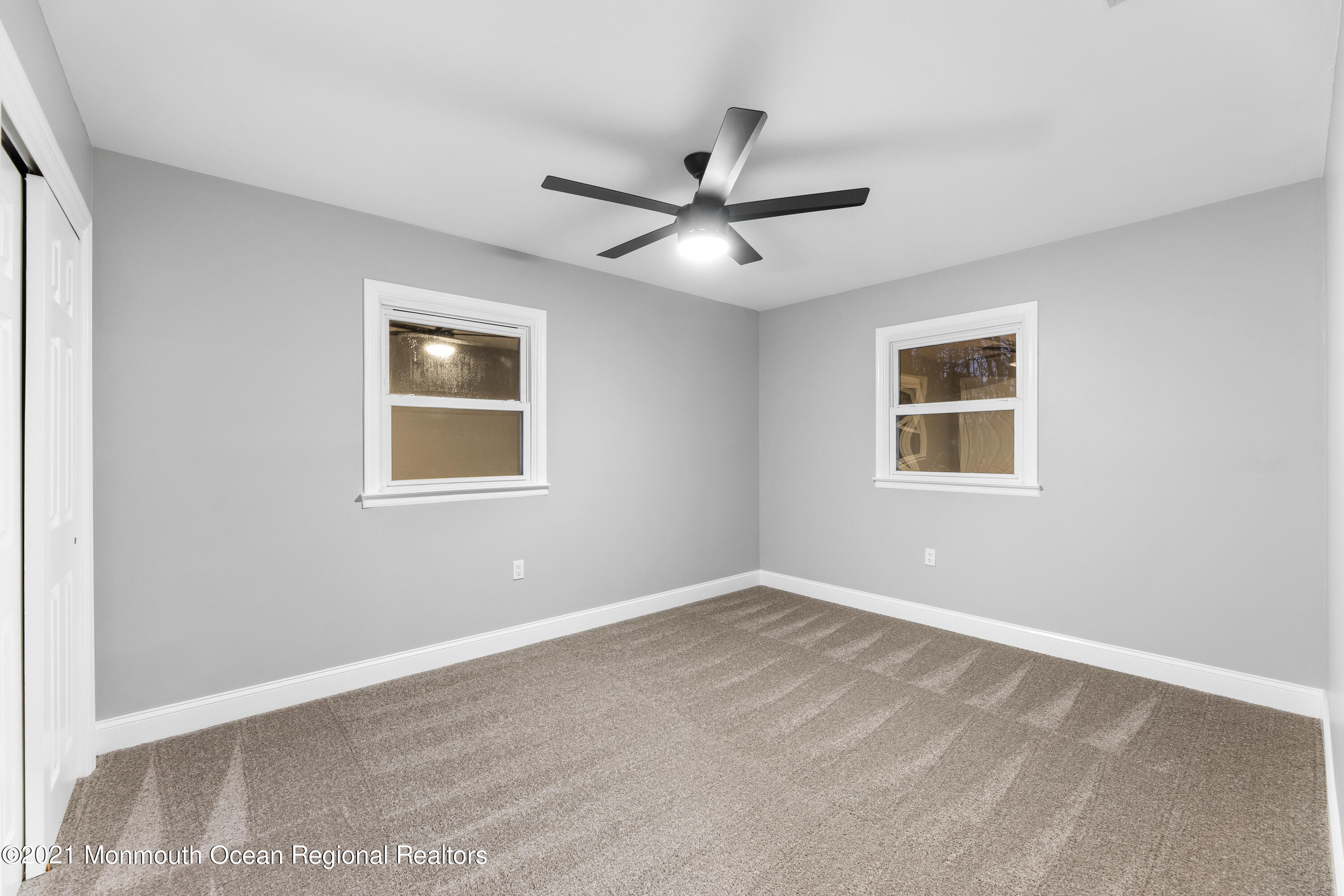 26 Squan Road Millstone Township, NJ 08510 - Photo 22 of 24 a view of a big room with wooden floor and windows