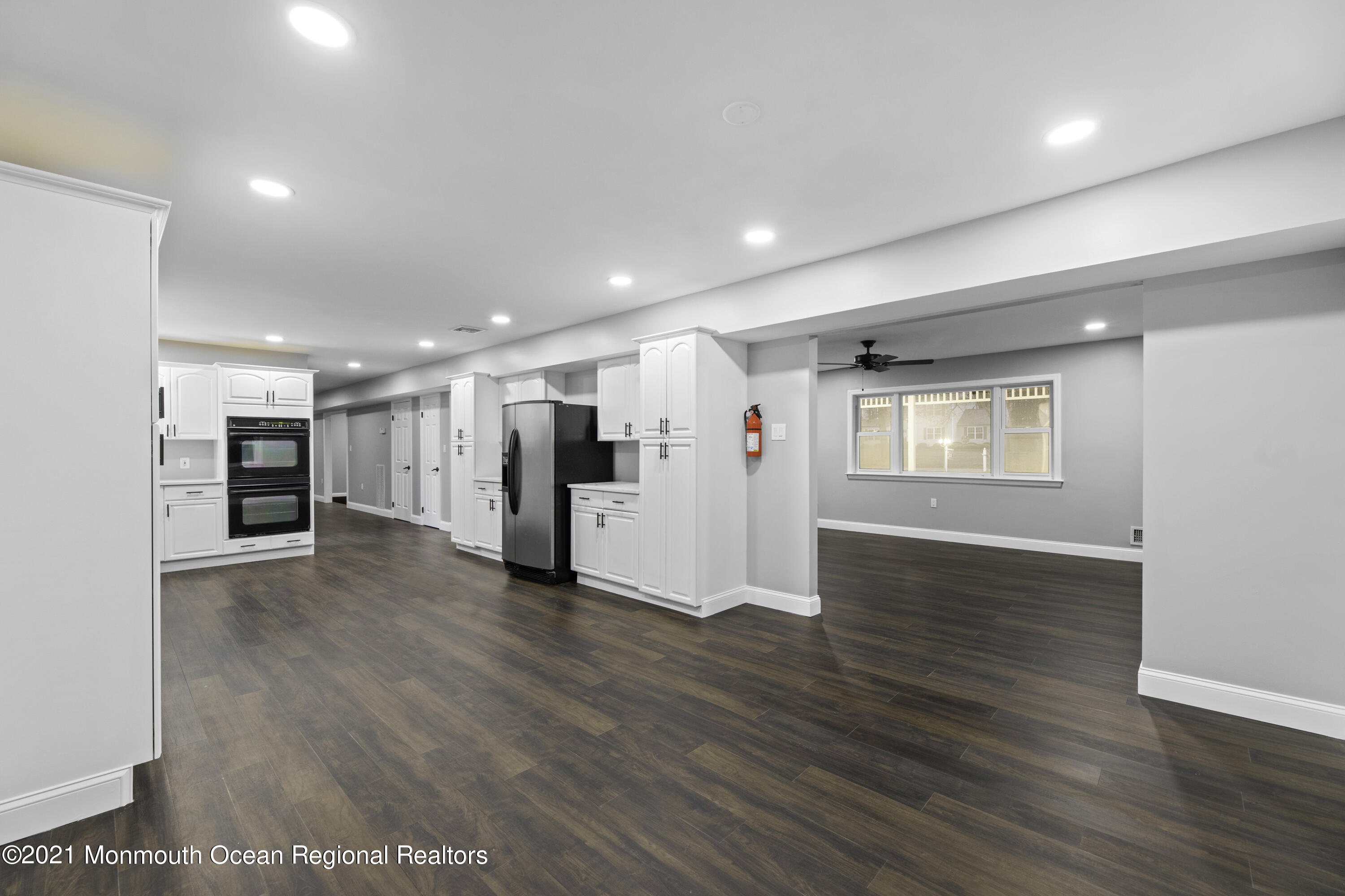 26 Squan Road Millstone Township, NJ 08510 - Photo 6 of 24 a view of a big room with wooden floors