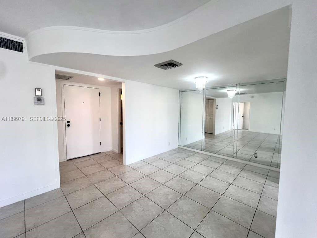 100 Golden Isles Drive, Unit 406 Hallandale Beach, FL 33009 - Photo 12 of 31 a view of an empty room