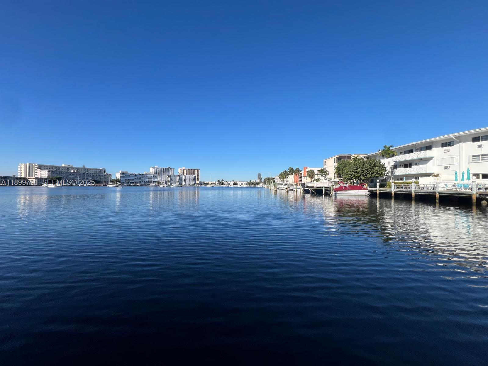 100 Golden Isles Drive, Unit 406 Hallandale Beach, FL 33009 - Photo 2 of 31 a view of ocean with boats