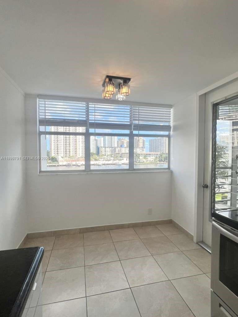 100 Golden Isles Drive, Unit 406 Hallandale Beach, FL 33009 - Photo 8 of 31 a view of an empty room with a window