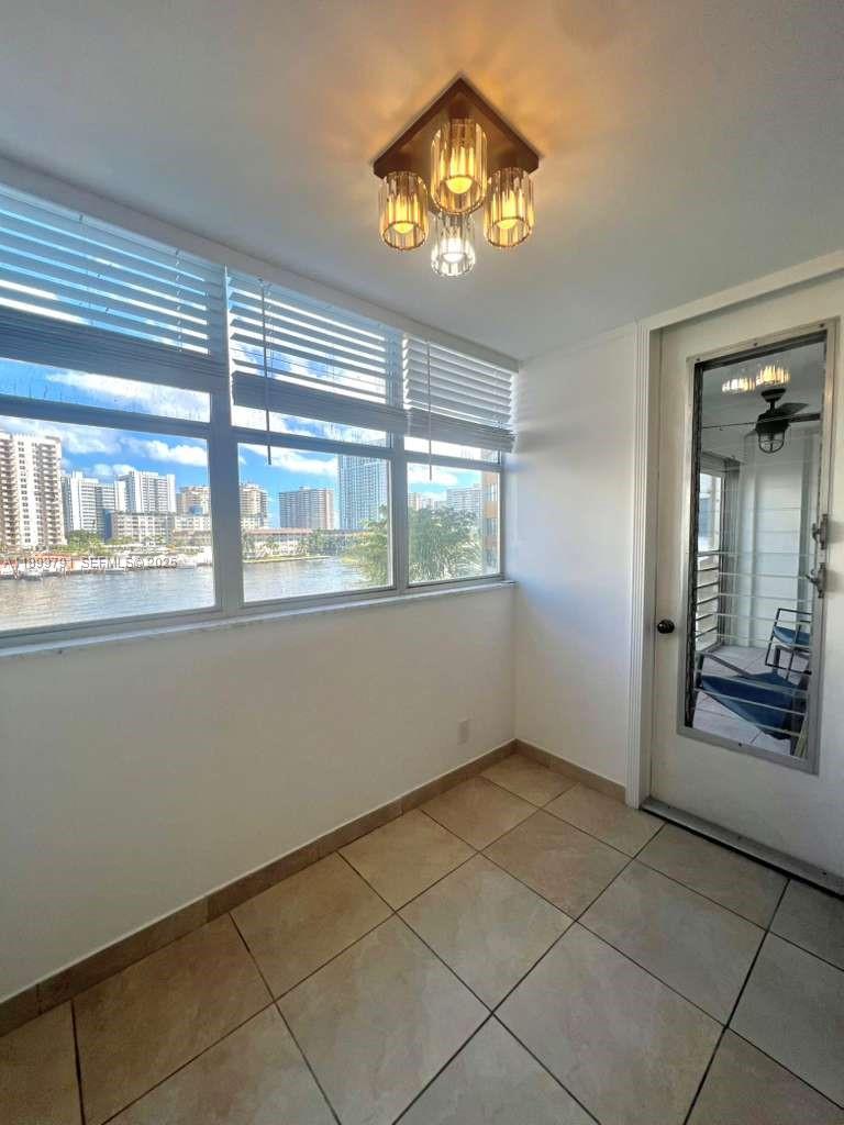 100 Golden Isles Drive, Unit 406 Hallandale Beach, FL 33009 - Photo 10 of 31 a view of an empty room with a window