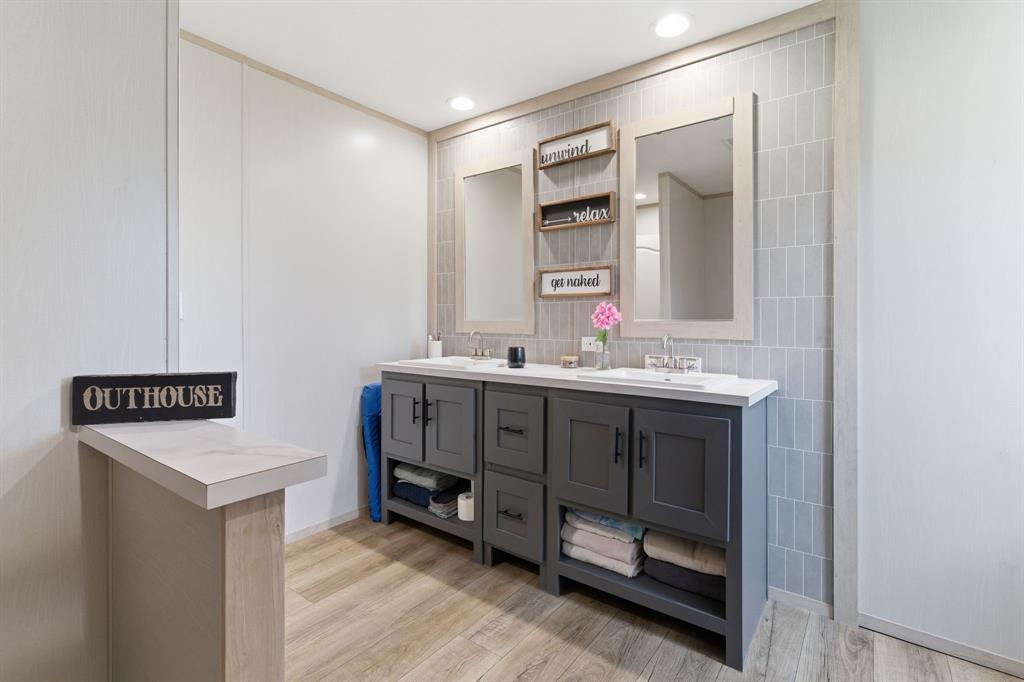 8792 Highway 67 Saltillo, TX 75478 - Photo 24 of 40 a bathroom with a sink and a mirror