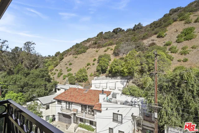 a view of a balcony with an outdoor space
