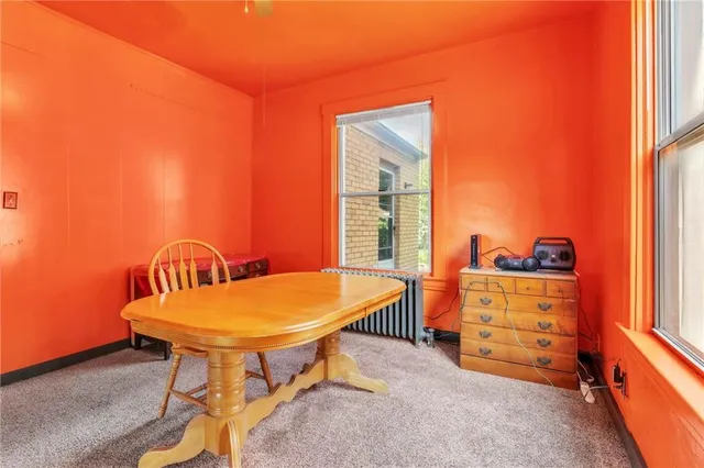 an empty room with wooden floor and closet